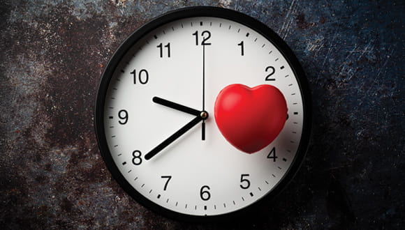 clock with a heart graphic