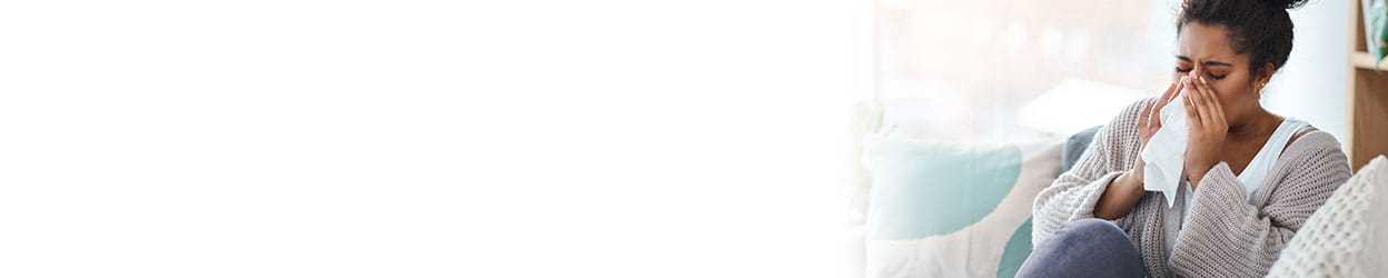 person blowing their nose