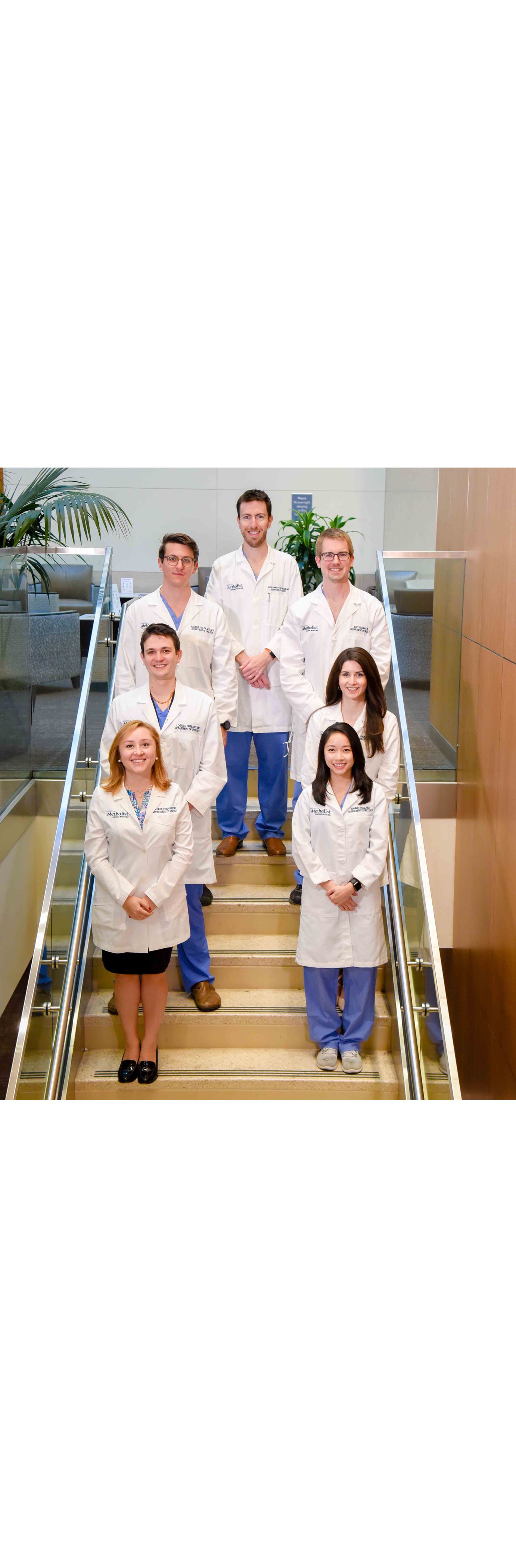 Urology Residents standing on stairway