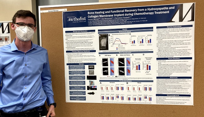Carson Benner presents his research poster