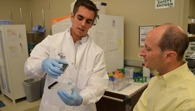 Intern and Mentor reviewing lab techniques