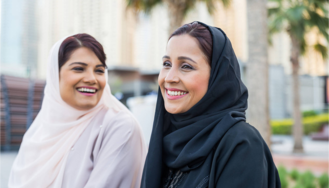 Two women talking and smiling 