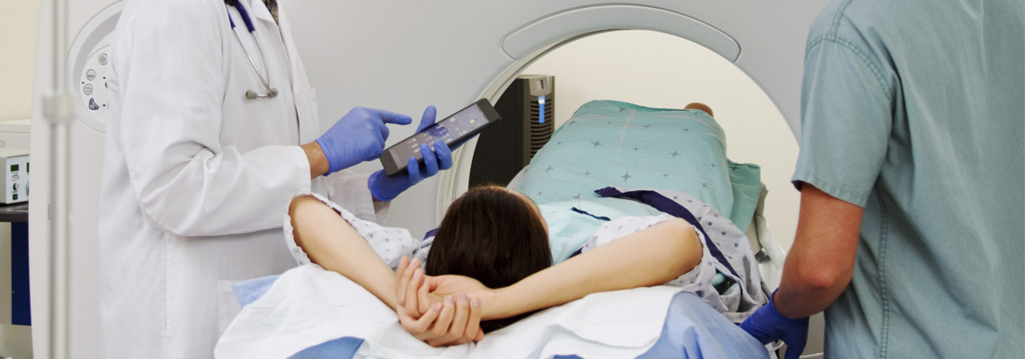 Orthopedic surgeons prepare patient for CT scan