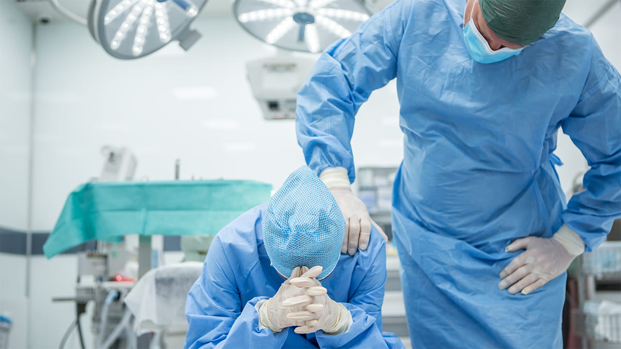 doctor comforting another doctor