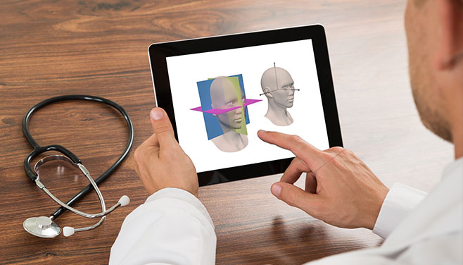 Doctor using AnatomicAligner, a new FDA-approved Methodist-built software program, on an iPad.