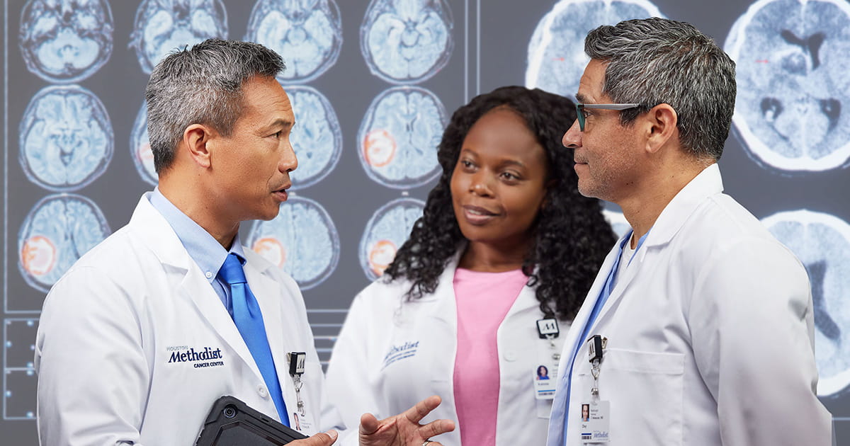 Three doctors conversing