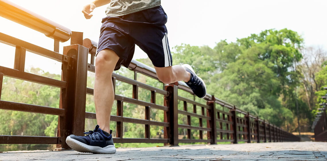 man running displaying foot and ankle