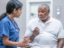 man talking to healthcare worker