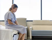 woman sitting on an examination table in a doctor's office