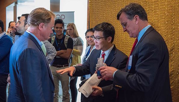 A lively discussion taking place between cardiologists at the Adult Congenital Heart Symposium