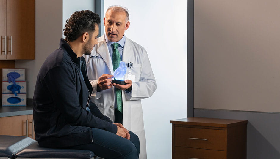 male patient in clinic with doctor