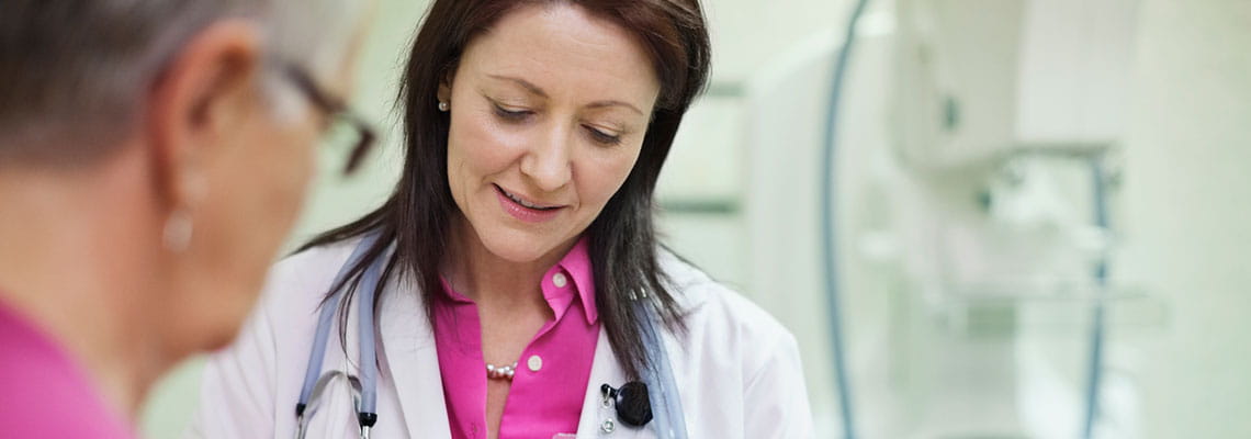 Female patient with doctor going over mamo gram results