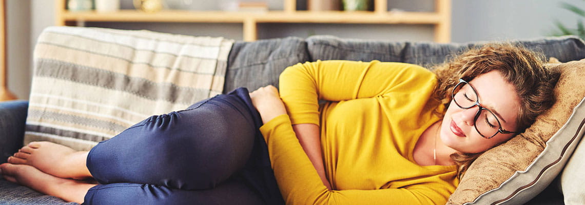 Women holding her stomach 