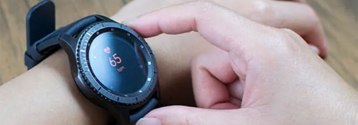 Person checking resting heart rate on smart watch