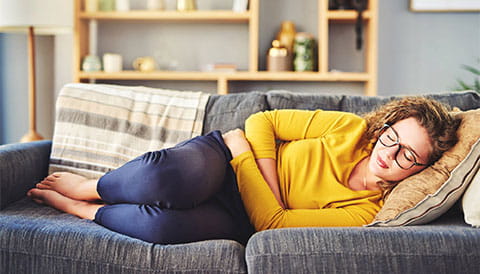 Women holding her stomach 