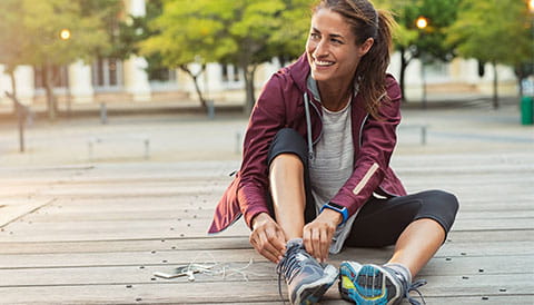 Women tying her running shoes
