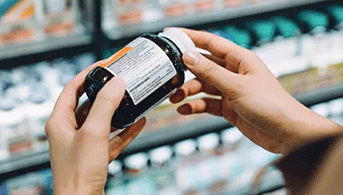 man holding supplements