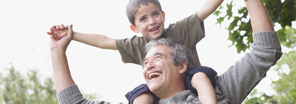 Man with grandson on his shoulders