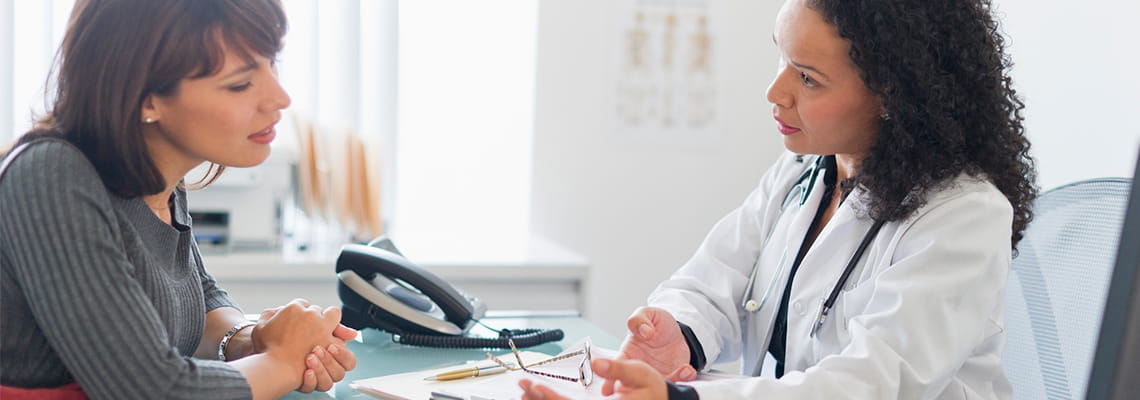 female patient in consult with female physician