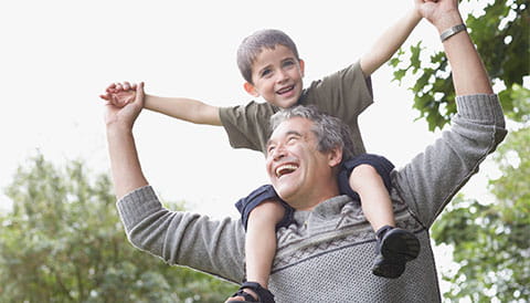 Man with grandson on his shoulders