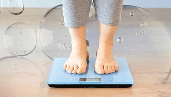 Women standing on scale